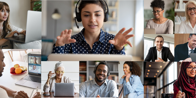 various professionals at smiling and happy at computer screens